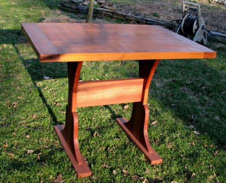 Contemporary industrial table made out of mahogany, all custom made for a nook
